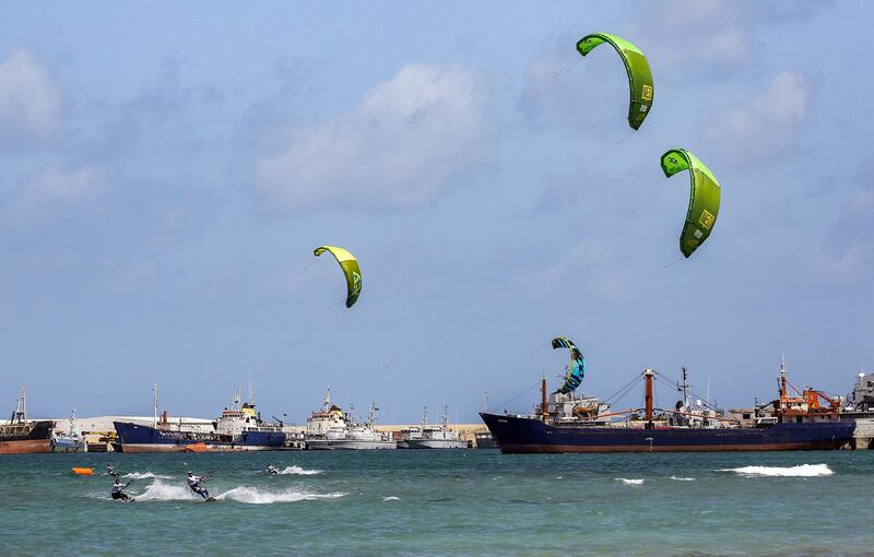 Libyans compete in a kite surfing tournament at the port of Tripoli. AFP