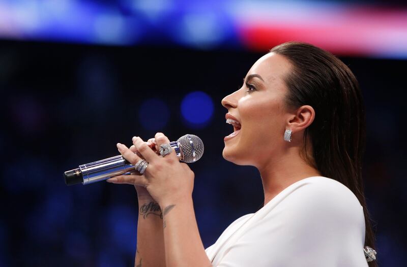 Demi Lovato sings the national anthem before the fight. Reuters