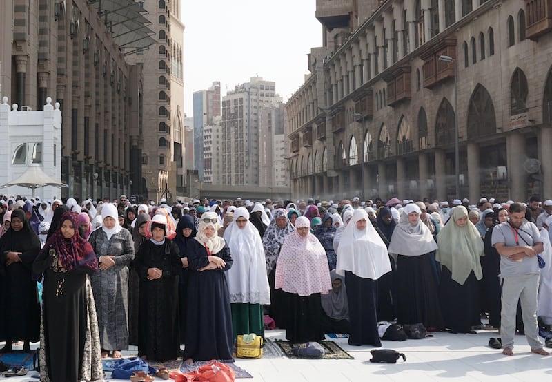 Muslim worshippers pray outside the Grand Mosque in the holy city of Mecca prior to the start of the annual Hajj pilgrimage. Karim Sahib / AFP