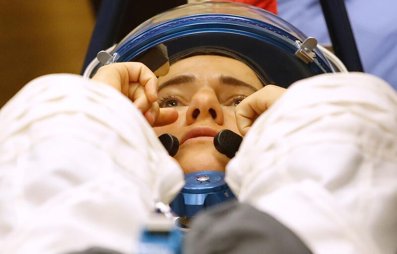 US astronaut Jessica Meir has her space suit inspected ahead of the launch. Dmitri Lovetsky / AP