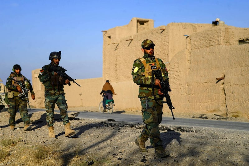 Afghan National Army (ANA) and Afghan Local Police (ALP) forces patrol during a cleaning operation in Pashtun Zarghun district of Herat province on November 28, 2020. (Photo by Hoshang Hashimi / AFP)