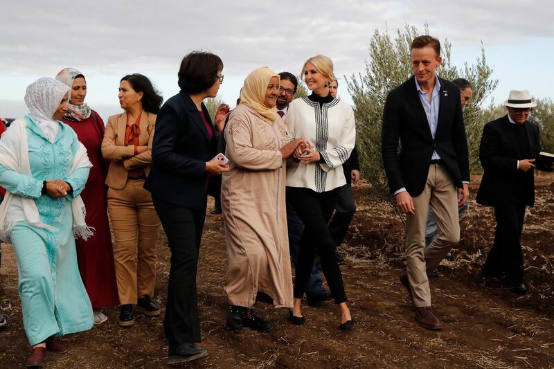 Ivanka Trump, the daughter and senior adviser to President Donald Trump, and Sean Cairncross, CEO of the Millennium Challenge Corporation, right, walk with Aicha Bourkib, centre, in the province of Sidi Kacem, Morocco, as they tour an olive grove collective where local women farmers are benefitting from changes allowing them to inherit land. AP Photo