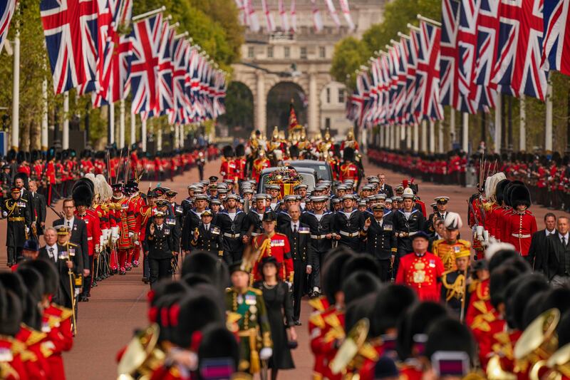 The coffin of Queen Elizabeth II is carried following her funeral service in Westminster Abbey in central London, Monday, Sept.  19, 2022.  The Queen, who died aged 96 on Sept.  8, will be buried at Windsor alongside her late husband, Prince Philip, who died last year.  (AP Photo / Vadim Ghirda, Pool)