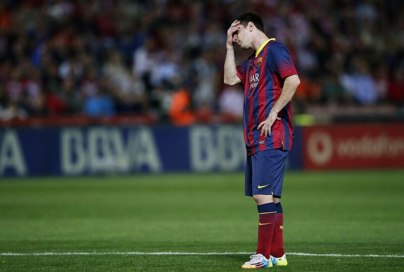 Barcelona's Lionel Messi reacts during the Primera Liga match against Granada at Nuevo Los Carmenes stadium in Granada on April 12, 2014. Marcelo del Pozo / Reuters
