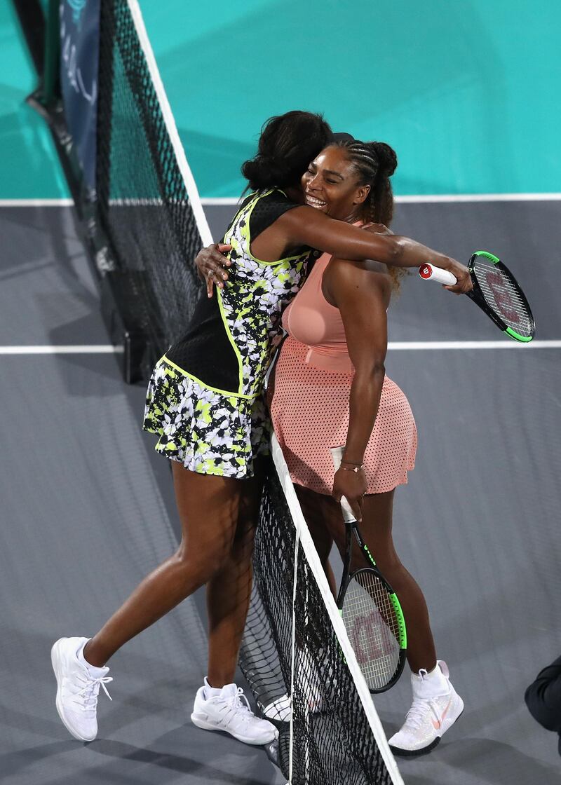 The sisters embrace after their match. Getty