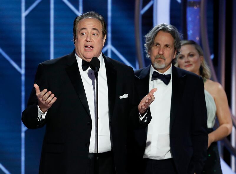 FILE - In this Jan. 6, 2019 file image released by NBC, Nick Vallelonga accepts the award for best screenplay for "Green Book" during the 76th annual Golden Globe Awards at the Beverly Hilton Hotel in Beverly Hills, Calif. Vallelonga apologized Thursday, Jan. 10 for a 2015 tweet about Muslims and 9/11 that has resurfaced. In the tweet, he said then-presidential-candidate Donald Trump was correct that television news on 9/11 showed Muslims in Jersey City cheering and he had seen it. Thereâ€™s no evidence such celebrations occurred.(Paul Drinkwater/NBC via AP, File)