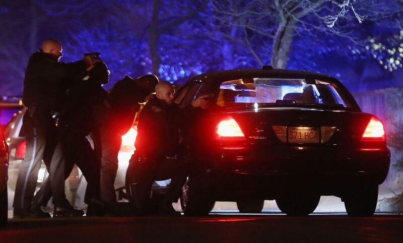 WATERTOWN, MA - APRIL 19: Police with guns drawn search for a suspect on April 19, 2013 in Watertown, Massachusetts. Earlier, a Massachusetts Institute of Technology campus police officer was shot and killed late Thursday night at the school's campus in Cambridge. A short time later, police reported exchanging gunfire with alleged carjackers in Watertown, a city near Cambridge. It's not clear whether the shootings are related or whether either are related to the Boston Marathon bombing.   Mario Tama/Getty Images/AFP== FOR NEWSPAPERS, INTERNET, TELCOS & TELEVISION USE ONLY ==
 *** Local Caption ***  943819-01-09.jpg