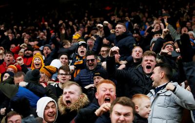 Soccer Football - Premier League - Wolverhampton Wanderers v Leicester City - Molineux Stadium, Wolverhampton, Britain - January 19, 2019  Wolverhampton Wanderers fans celebrate after Diogo Jota (not pictured) scored their fourth goal  Action Images via Reuters/Craig Brough  EDITORIAL USE ONLY. No use with unauthorized audio, video, data, fixture lists, club/league logos or "live" services. Online in-match use limited to 75 images, no video emulation. No use in betting, games or single club/league/player publications.  Please contact your account representative for further details.     TPX IMAGES OF THE DAY