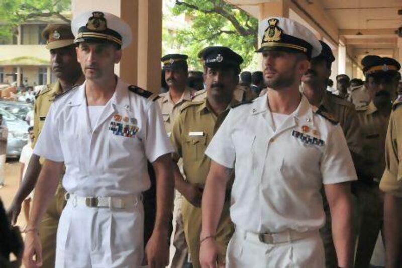 Italian marines Latore Massimiliano and Salvatore Girone are escorted by Indian police outside a court in Kollam on May 25, 2012.
