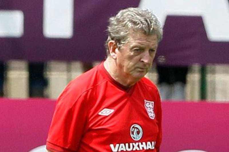 England's soccer team manager Roy Hodgson is watched by fans during a training session at their training ground in Krakow ahead of the Euro 2012 soccer championship, in Krakow, Poland, Friday, June 8, 2012. (AP Photo/Kirsty Wigglesworth)