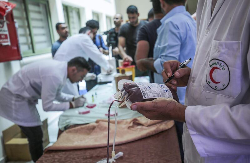Palestinians donate blood during an event organized by the municipality, the Red Crescent, and the Ministry of Health in Khan Yunis in the southern Gaza Strip in support of Lebanon.  AFP