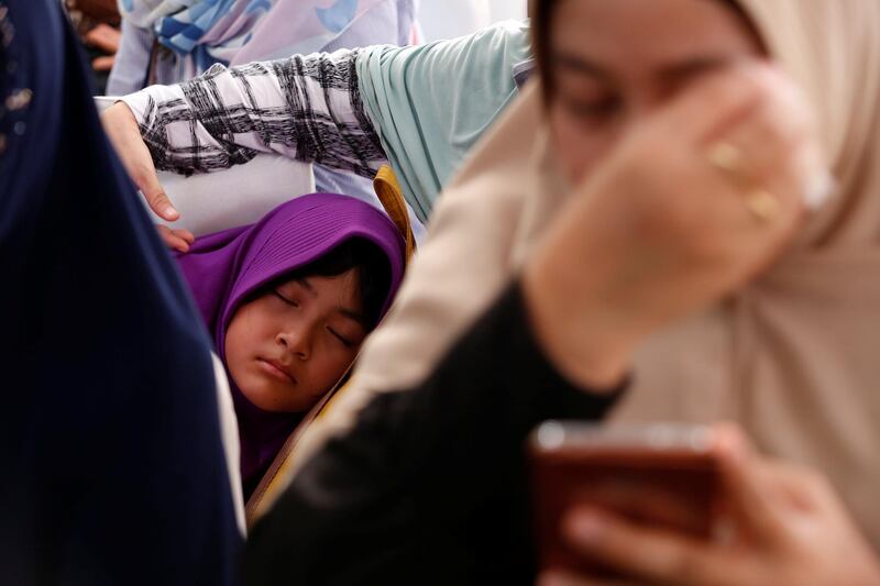 A girl who is a relative of a passenger on the crashed Lion Air flight sleeps at Bhayangkara R Said Sukanto hospital in Jakarta, Indonesia. Reuters