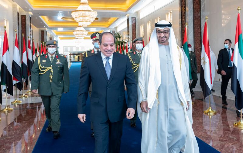 Sheikh Mohamed bin Zayed, Crown Prince of Abu Dhabi and Deputy Supreme Commander of the Armed Forces, right, receives Egypt's President Abdel Fattah El Sisi, at the Presidential Airport in Abu Dhabi. Photo: Abdulla Al Neyadi for Ministry of Presidential Affairs