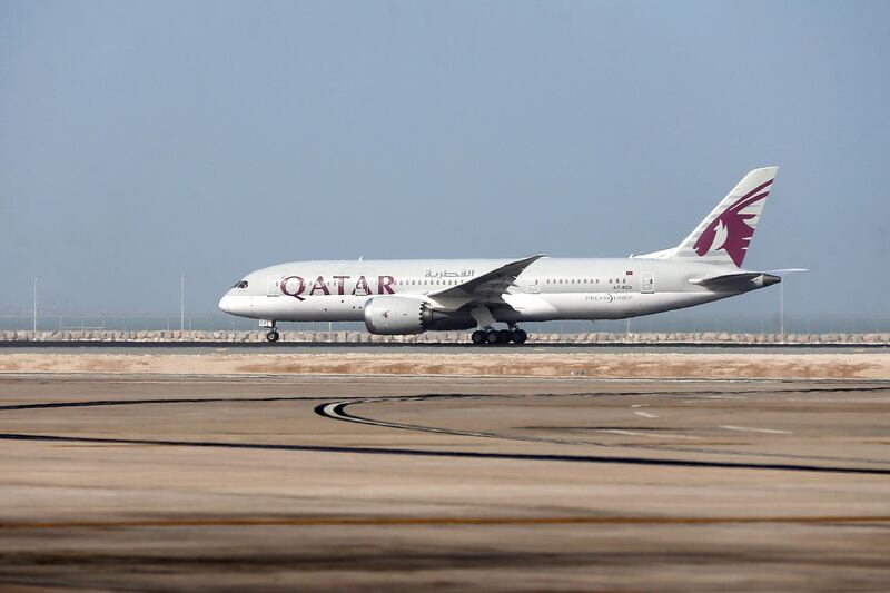 (FILES) This file photo taken on July 20, 2017 shows a Qatar Airways plane taking-off from the Hamad International Airport in Doha.  
Qatar Airways drops plan to buy stake in American Airlines, on August 3, 2017.
 / AFP PHOTO / STRINGER