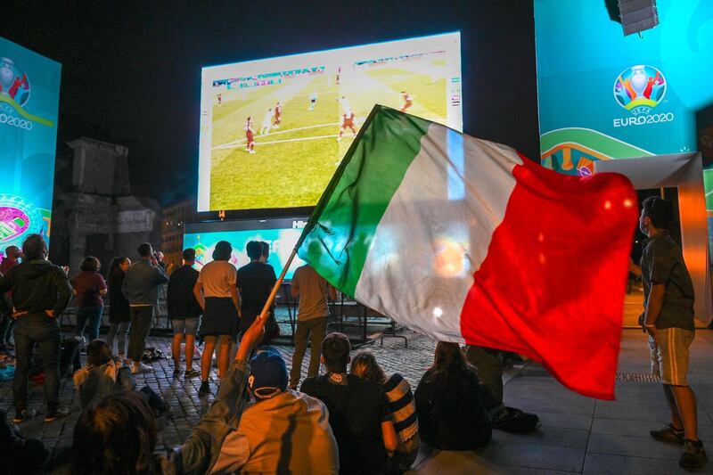 Italy supporters watch at a fan zone on the Roman Forum in Rome as their side beat Turkey. AFP