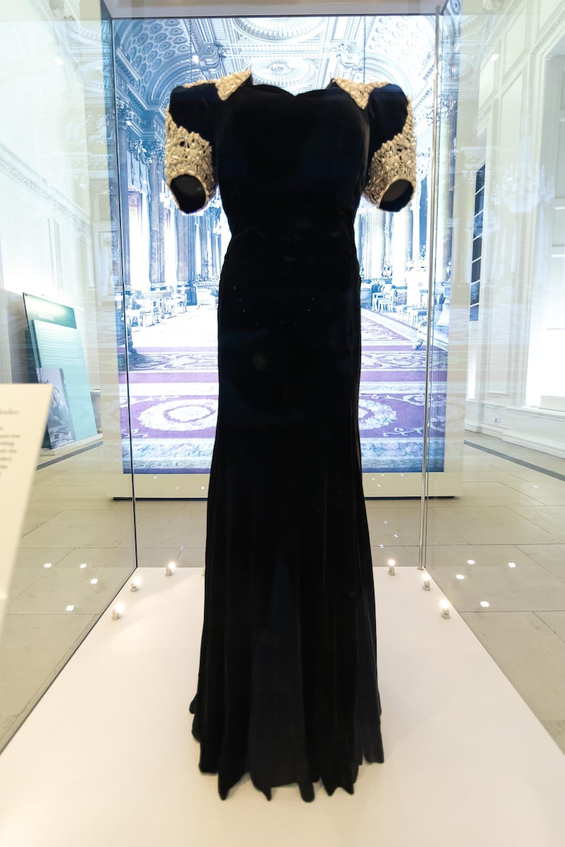 An evening dress worn by Queen Elizabeth, The Queen Mother, is displayed in the Royal Style in the Making exhibition at Kensington Palace in London. Getty Images