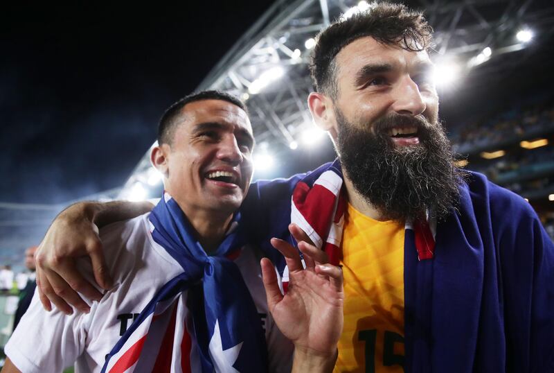 Tim Cahill, left, and Mile Jedinak celebrate after Australia book their place at the 2018 World Cup in Russia. Matt King / Getty Images