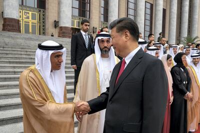 BEIJING, CHINA - July 22, 2019:  HE Xi Jinping, President of China (R) greets HE Dr Ali Obaid Al Dhaheri, UAE Ambassador to China (L), during a reception at the Great Hall of the People.

( Mohamed Al Hammadi / Ministry of Presidential Affairs )
---
