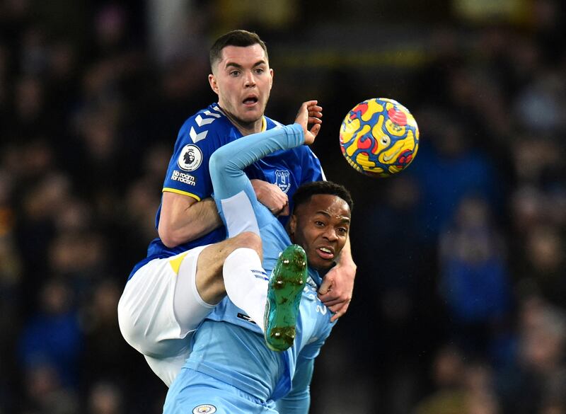 Manchester City's Raheem Sterling vies for the ball with Everton's Michael Keane. Reuters