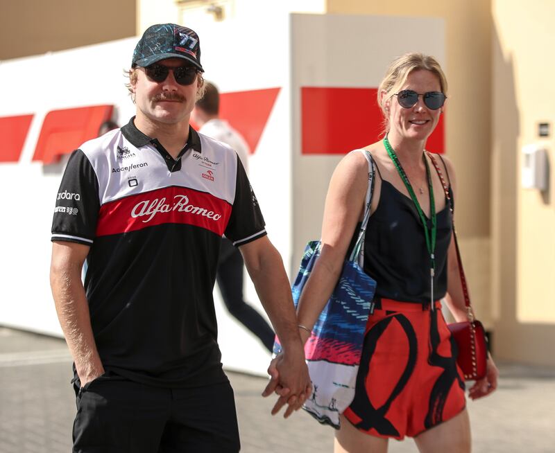 Alfa Romeo driver Valtteri Bottas with girlfriend, Tiffany Cromwell, arrive at Yas Marina Circuit