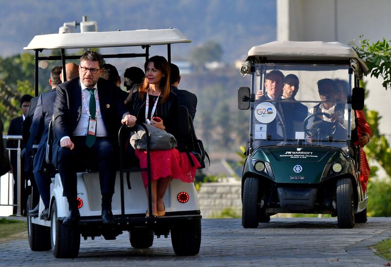 Italy's Finance Minister Giancarlo Giorgetti, left, with other G20 delegates on the outskirts of Bengaluru, India. Reuters
