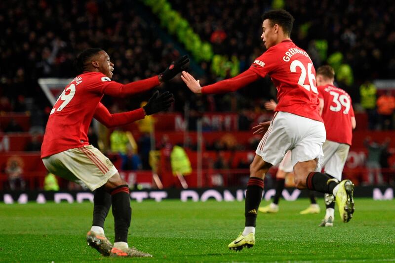 Manchester United striker Mason Greenwood (R) celebrates scoring their equaliser. AFP