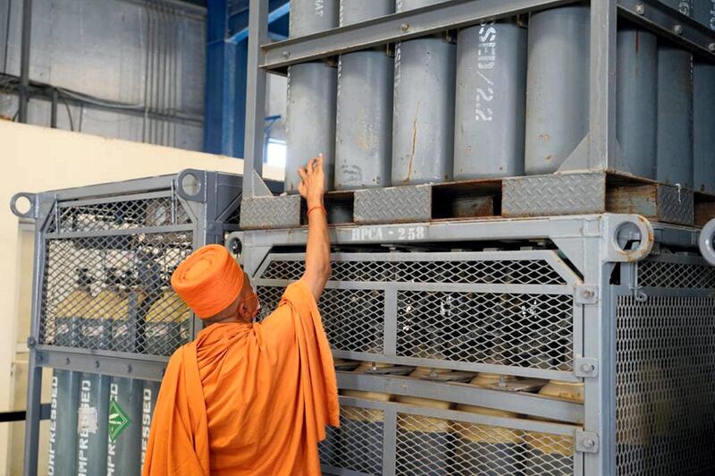 Swami Brahmavihari, a priest with Baps Swaminarayan Sanstha, conducts a traditional Hindu prayer before shipping 600 oxygen cylinders to hospitals in India. Courtesy: Baps Hindu Mandir 
