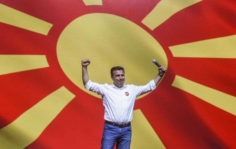 Zoran Zaev, leader of the ruling SDSM party gestures as he greets supporters during an election campaign rally in Skopje. North Macedonia. AFP