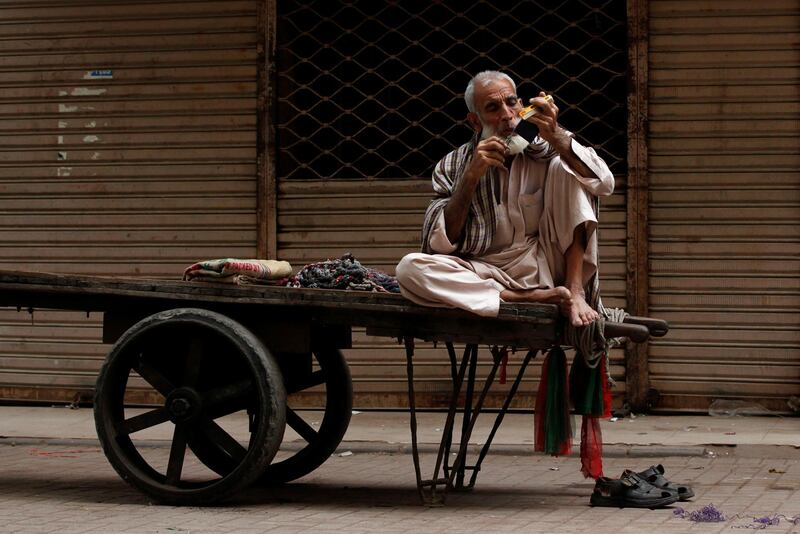 A labourer trims his moustache at a market in Karachi, Pakistan. Akhtar Soomro / Reuters