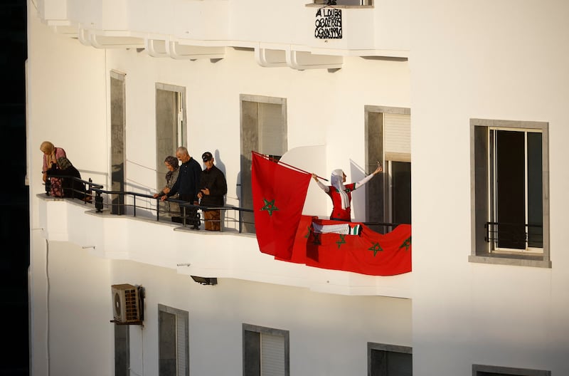 Moroccans gathered on their balconies and hung flags in anticipation of the team's return. Reuters 
