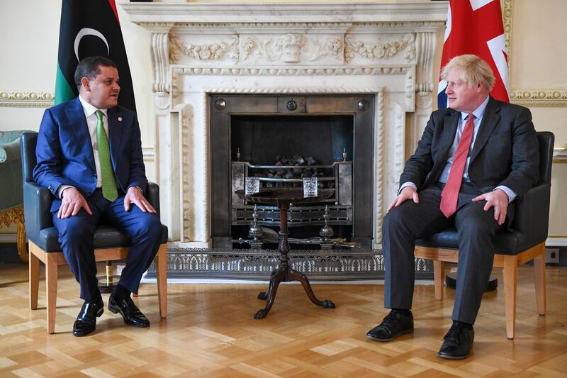 epa09298948 Britain's Prime Minister Boris Johnson (R) and Libya's interim prime minister Abdul Hamid Mohammed Dbeibah (L) during their bilateral meeting at number 10 Downing Street in London, Britain, 24 June 2021. International powers stressed the need for foreign fighters and mercenaries to be gradually withdrawn from Libya to avoid a lopsided power balance, tackling head on a major sticking point in the conflict that has ravaged theÂ OPECÂ member.  EPA/CHRIS J. RATCLIFFE / POOL