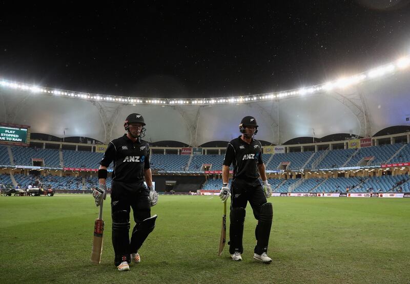 DUBAI, UNITED ARAB EMIRATES - NOVEMBER 11:  George Worker and Henry Nicholls of New Zealand leave the field as rain stops play during the 3rd One Day International match between Pakistan and New Zealand at Dubai International Stadium on November 11, 2018 in Dubai, United Arab Emirates.  (Photo by Francois Nel/Getty Images)