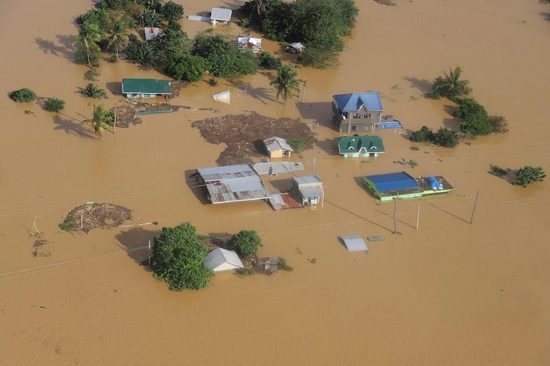 This handout aerial photo taken and recieved on November 14, 2020 from the Philippine Coast Guard shows submerged houses in Cagayan province, north of Manila, on November 14, 2020, days after Typhoon Vamco hit parts of the country bringing heavy rain and flooding. (Photo by Handout / Philippine Coast Guard / AFP) / -----EDITORS NOTE --- RESTRICTED TO EDITORIAL USE - MANDATORY CREDIT "AFP PHOTO / PHILIPPINE COAST GUARD " - NO MARKETING - NO ADVERTISING CAMPAIGNS - DISTRIBUTED AS A SERVICE TO CLIENTS