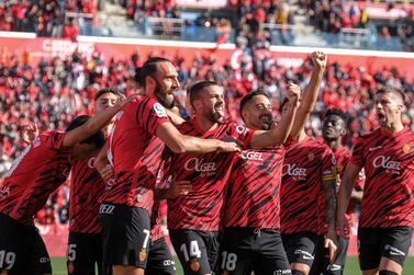 Mallorca's players celebrate the 1-0 goal scored by their forward Vedat Muriqi (2-L) during the Spanish LaLiga soccer match between RCD Mallorca and Real Madrid, in Mallorca, Spain, 05 February 2023.   EPA / CATI CLADERA