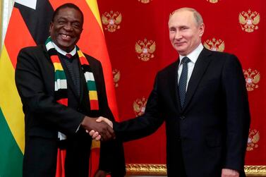 Russian President Vladimir Putin (R) shakes hands with Zimbabwean President Emmerson Mnangagwa (L) during a signing ceremony following their talks in the Kremlin in Moscow, on January 15, 2019. Zimbabwean President arrived in Moscow on a three-day official visit. / AFP / POOL / Sergei CHIRIKOV