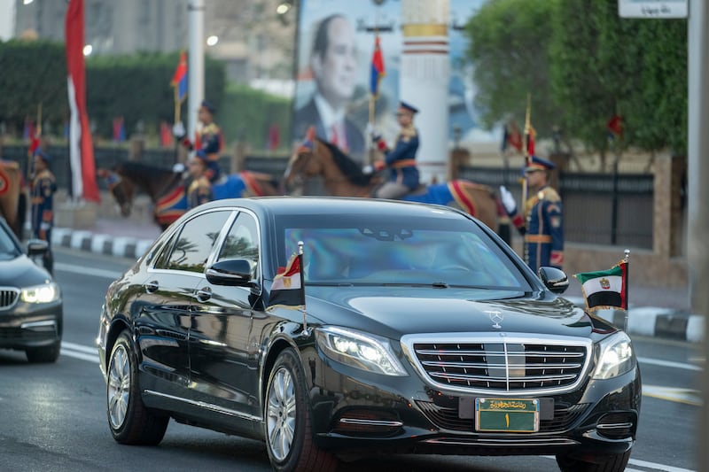 Sheikh Mohamed travels by motorcade to a reception hosted by Mr El Sisi. Photo: Hamad Al Kaabi / UAE Presidential Court