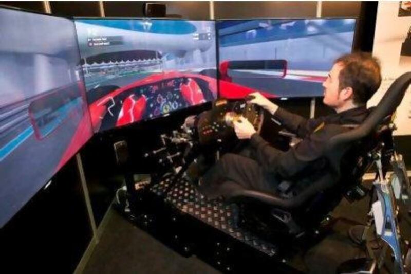 Pere Bascompte takes a test drive in a fully integrated F1 driving simulator at the CXC Simulations stand.