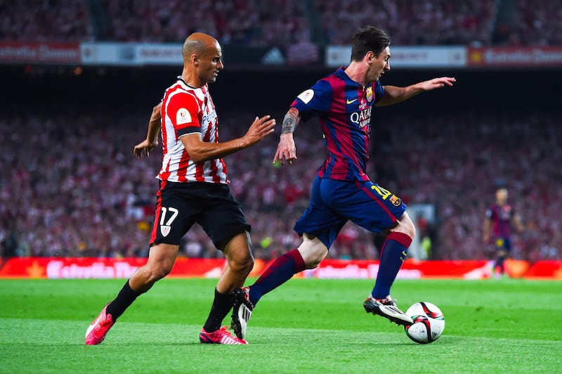 BARCELONA, SPAIN - MAY 30:  Lionel Messi of FC Barcelona competes for the ball with Mikel Rico of Athletic Club on his way to scores the opening goal during the Copa del Rey Final match between FC Barcelona and Athletic Club at Camp Nou on May 30, 2015 in Barcelona, Spain.  (Photo by David Ramos/Getty Images)