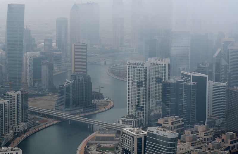Low cloud and rain in Downtown Dubai. Chris Whiteoak / The National