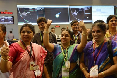 Indian Space Research Organisation staff celebrate after Mangalyaan entered into orbit around Mars in 2014. AFP