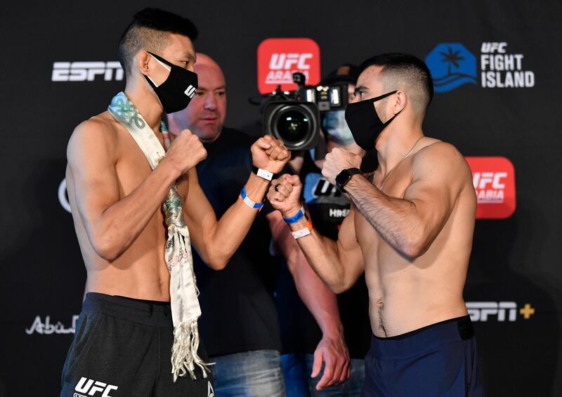 ABU DHABI, UNITED ARAB EMIRATES - JANUARY 19: (L-R) Opponents Sumudaerji of Tibet and Zarrukh Adashev of Uzbekistan face off during the UFC weigh-in at Etihad Arena on UFC Fight Island on January 19, 2021 in Abu Dhabi, United Arab Emirates. (Photo by Jeff Bottari/Zuffa LLC) *** Local Caption *** ABU DHABI, UNITED ARAB EMIRATES - JANUARY 19: (L-R) Opponents Sumudaerji of Tibet and Zarrukh Adashev of Uzbekistan face off during the UFC weigh-in at Etihad Arena on UFC Fight Island on January 19, 2021 in Abu Dhabi, United Arab Emirates. (Photo by Jeff Bottari/Zuffa LLC)