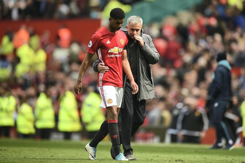 Manchester United's Portuguese manager Jose Mourinho (R) talks with Manchester United's English striker Marcus Rashford (L) as they leave the pitch at the end of the English Premier League football match between Manchester United and Swansea City at Old Trafford in Manchester, north west England, on April 30, 2017. / AFP PHOTO / Oli SCARFF / RESTRICTED TO EDITORIAL USE. No use with unauthorized audio, video, data, fixture lists, club/league logos or 'live' services. Online in-match use limited to 75 images, no video emulation. No use in betting, games or single club/league/player publications.  / 