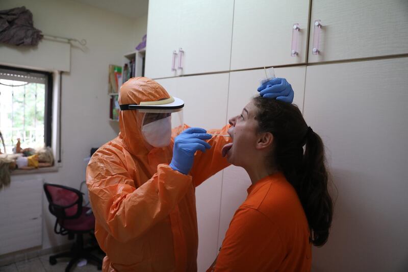 Member of the United Hatzalah emergency medical services organization wearing a  protective suit collects a Coronavirus swab sample in Jerusalem. The Israeli cabinet approved a full three weeks lockdown during the Jewish holidays period beginning on 18 September aimed to prevent the spread of the coronavirus and COVID-19 disease outbreak.  EPA