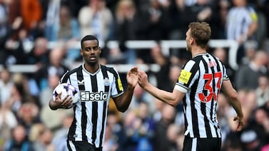 NEWCASTLE UPON TYNE, ENGLAND - APRIL 27: Alexander Isak of Newcastle United celebrates scoring his team's first goal with teammate Dan Burn during the Premier League match between Newcastle United and Sheffield United at St. James Park on April 27, 2024 in Newcastle upon Tyne, England. (Photo by Stu Forster / Getty Images)