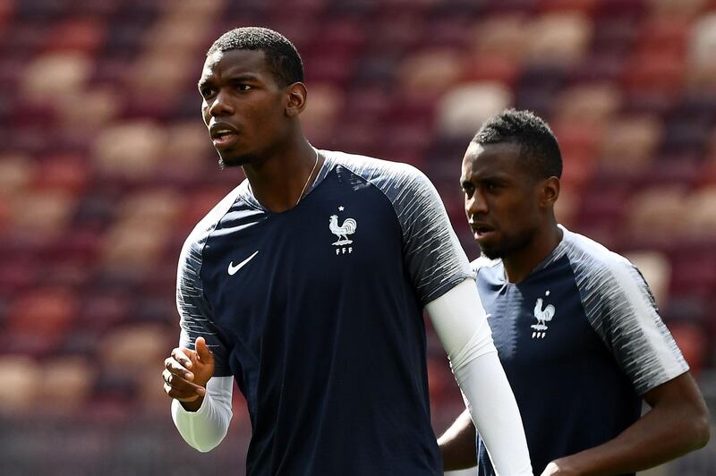 France's midfielder Paul Pogba (C) reacts as he takes part in a training session of France national football team at the Luzhniki Stadium in Moscow on June 25, 2018, on the eve of the Russia 2018 FIFA World Cup Group C football match between Danemark and France. / AFP / FRANCK FIFE
