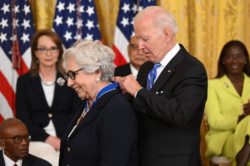 Mr Biden presents educator Dr Julieta Garcia with the Presidential Medal of Freedom. AFP