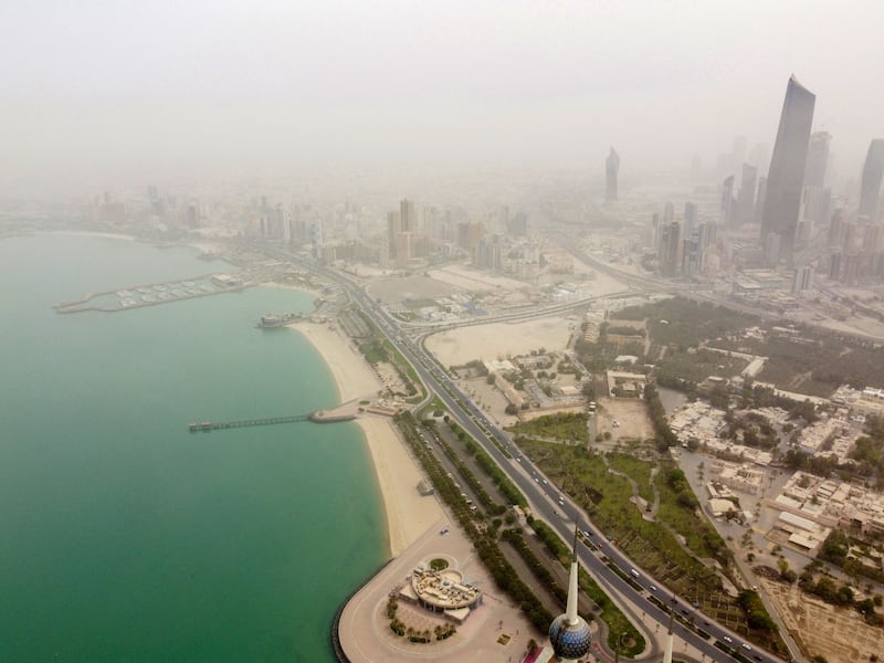 An aerial view shows Kuwait City during a dust storm on April 24, 2022.  (Photo by YASSER AL-ZAYYAT  /  AFP)