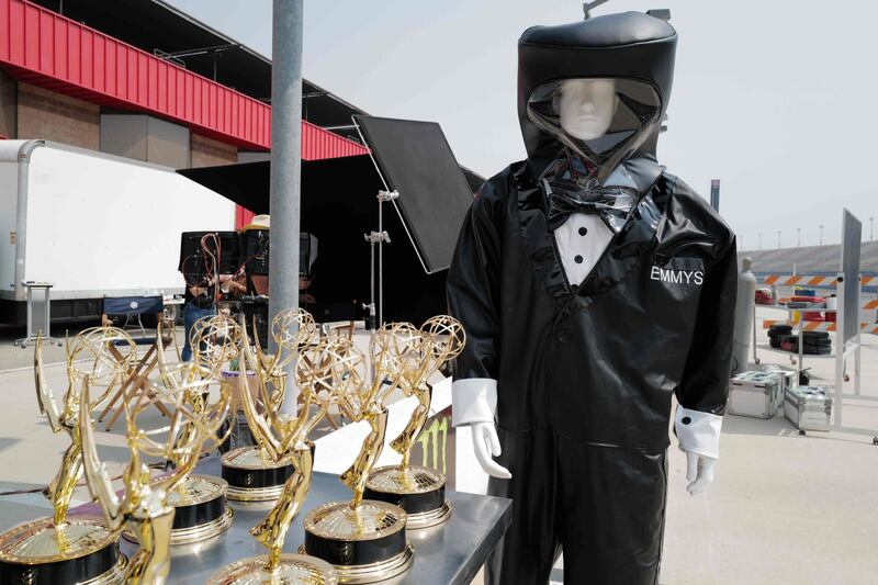 ABC shows a manequin wearing a hazmat tuxedo suit next to a table full of Emmy statues ahead of the 72nd Primetime Emmy Awards ceremony held virtually on September 20, 2020. AFP