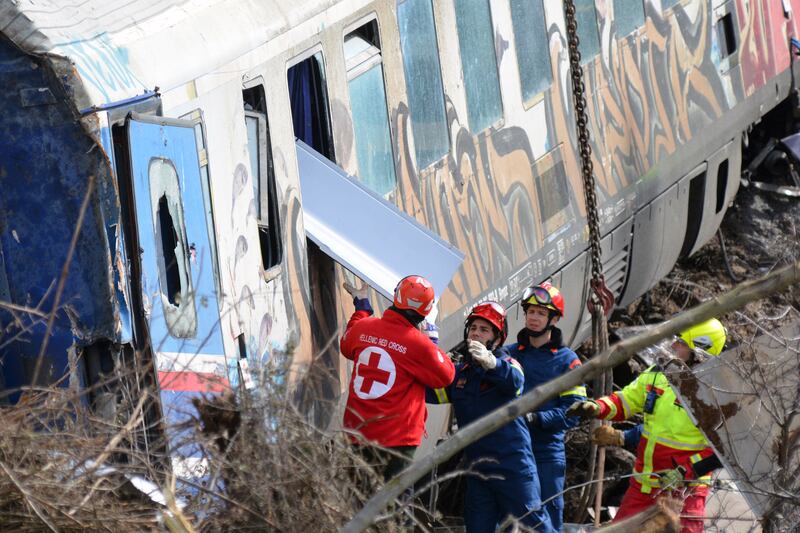 Firefighters and rescuers work at the crash scene. EPA