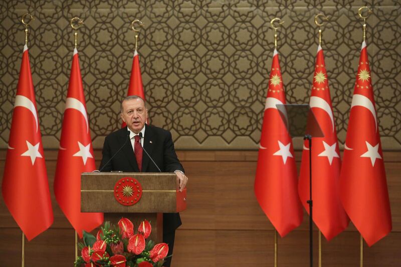ANKARA, TURKEY - JULY 9: Turkey's President Tayyip Erdogan announces the new ministers of his cabinet during a press conference at the Presidential Palace on July 9, 2018 in Ankara, Turkey. Erdoan appointed Chief of General Staff Gen. Hulusi Akar as the new defense minister and his son-in-law Berat Albayrak as the Treasury and Finance Minister in a 16-seat surprise cabinet with not much known bureaucratic figures, hours after he was sworn into office on July 9. Erdogan secured another five year term and increased powers after winning 52.5 percent of the vote in the June 24 snap presidential and parliamentary elections. Turkey has been under a state of emergency since the July 2016 failed coup attempt and since then the government has arrested, sacked and detain over 100,000 people said to be supporters of religious leader Fethullah Gulen. Erdogan announced that the current state of emergency would be lifted on July 18, 2018. (Photo by Stringer/Getty Images)